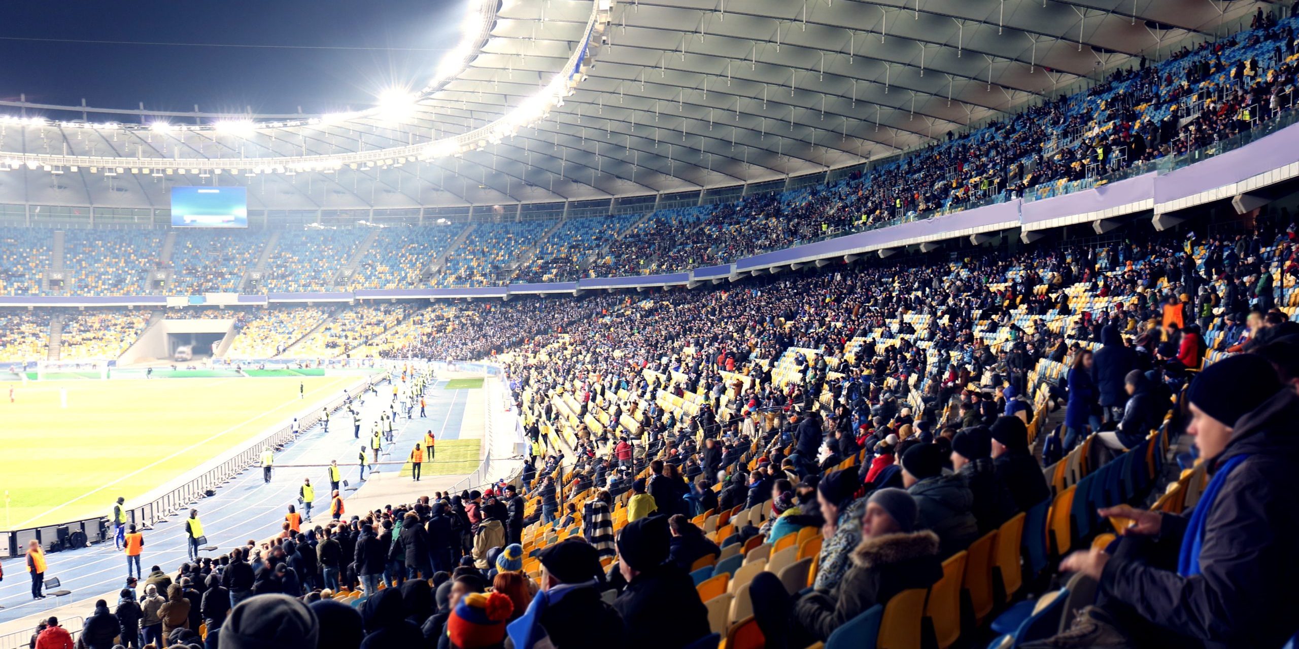 Fans watching football game at stadium