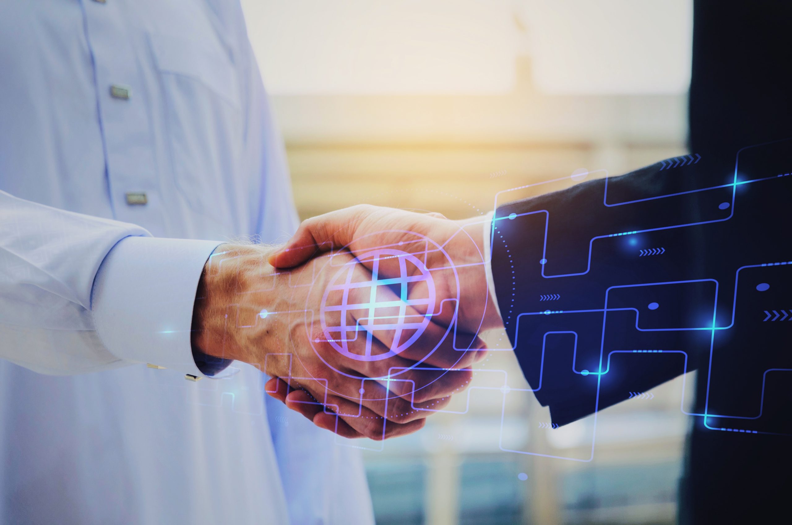 close up hand of young Arabian man in white suit handshake after finishing up meeting with graphic network diagram, partnership, teamwork, technology, connection, financial and investment concept
